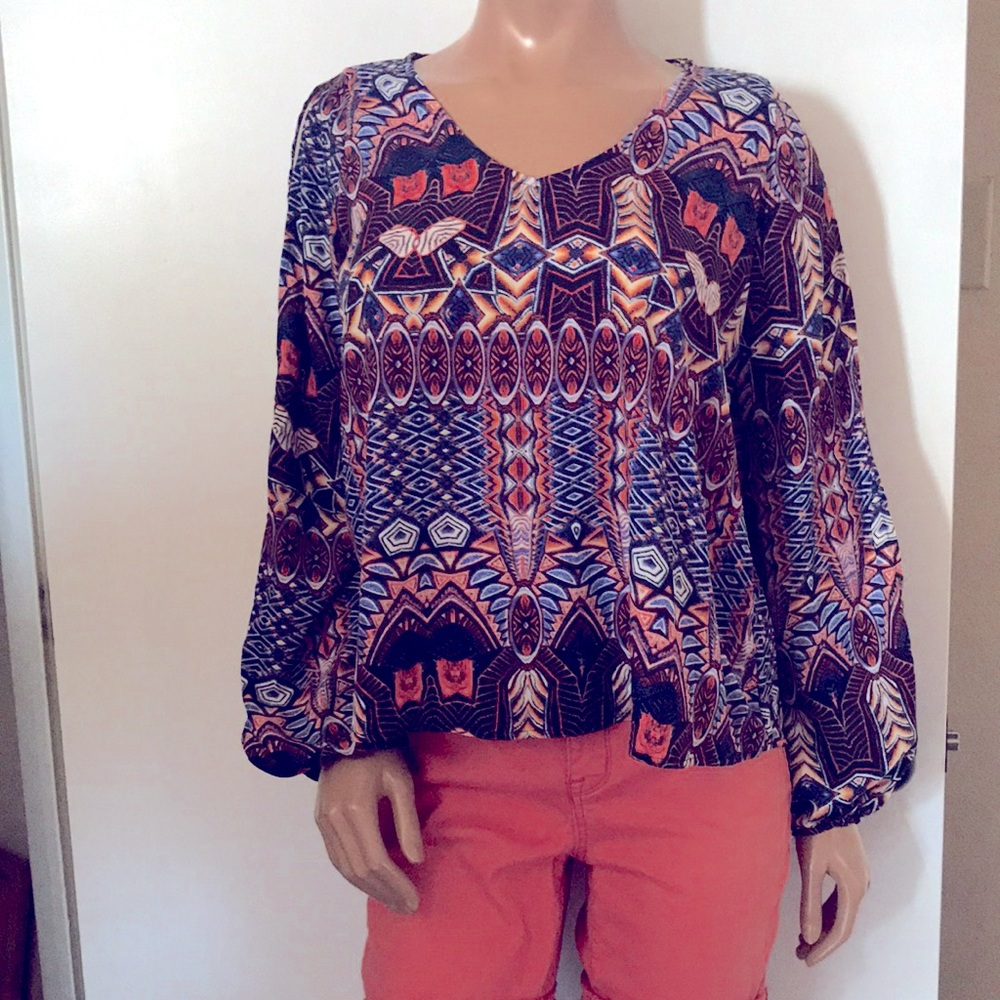 Size large blouse with slit sleeves. Comfy.